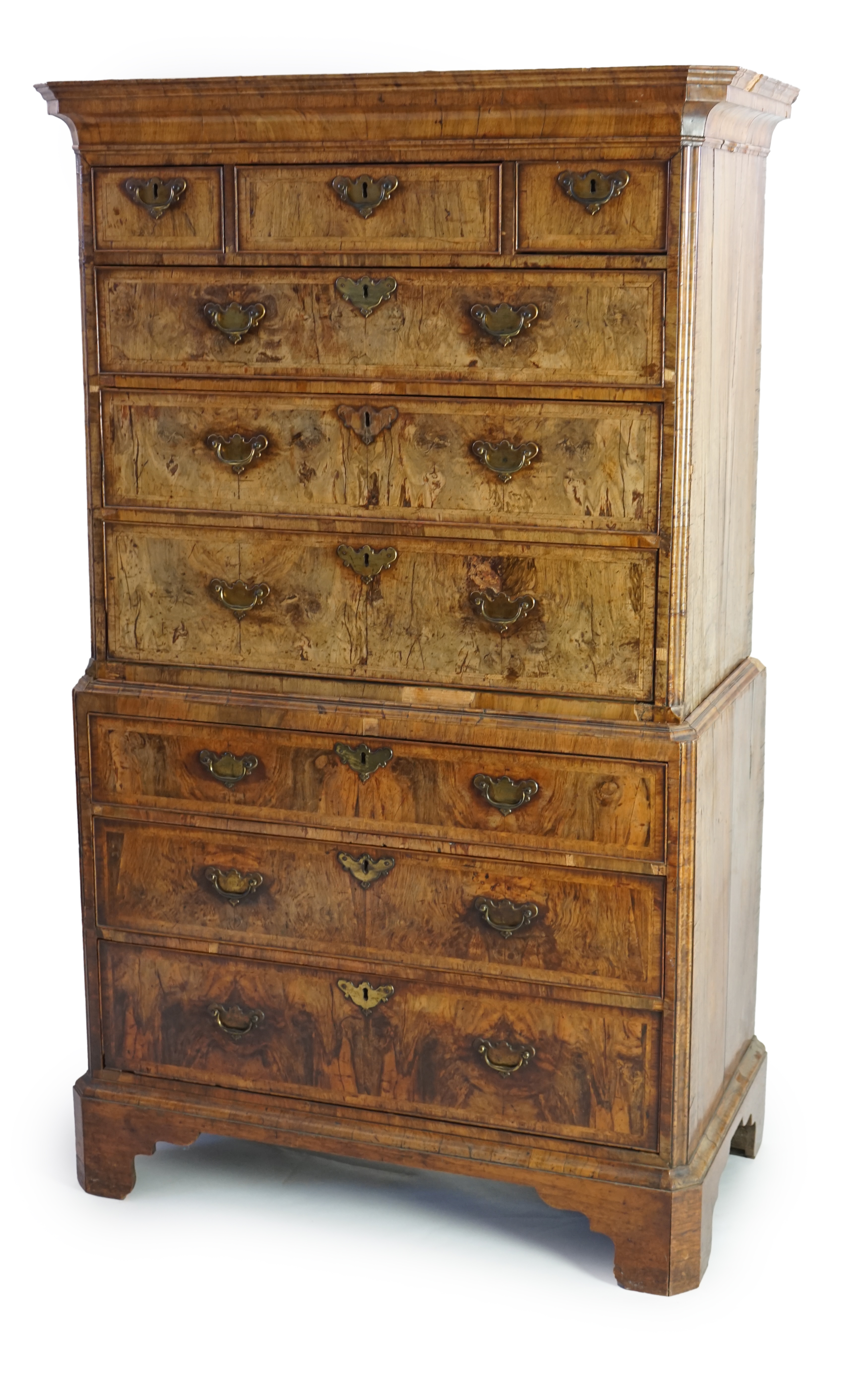 A George II feather banded walnut chest on chest